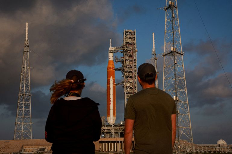 People look at NASA's next moon rocket, a Space Launch System (SLS) rocket with an Orion crew capsule, on Pad 39B before the launch of the Artemis II mission at the Kennedy Space Center in Cape Canaveral, Florida, US, March 29, 2026. REUTERS/Brendan McDermid